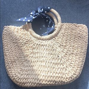 Large straw bag with navy blue ribbon